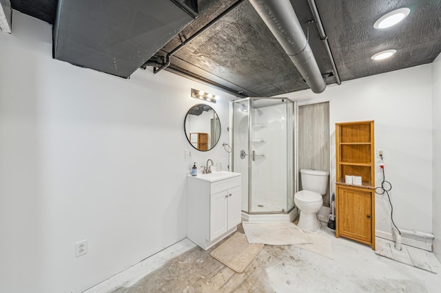bathroom with vanity, toilet, and a shower stall
