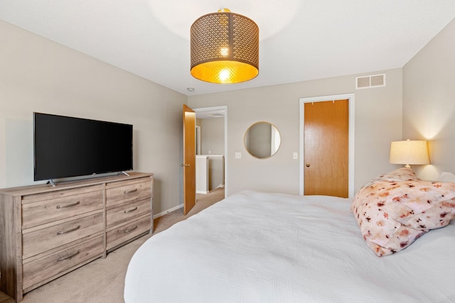 bedroom with baseboards, visible vents, and light carpet