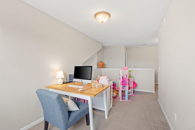 carpeted office space with baseboards