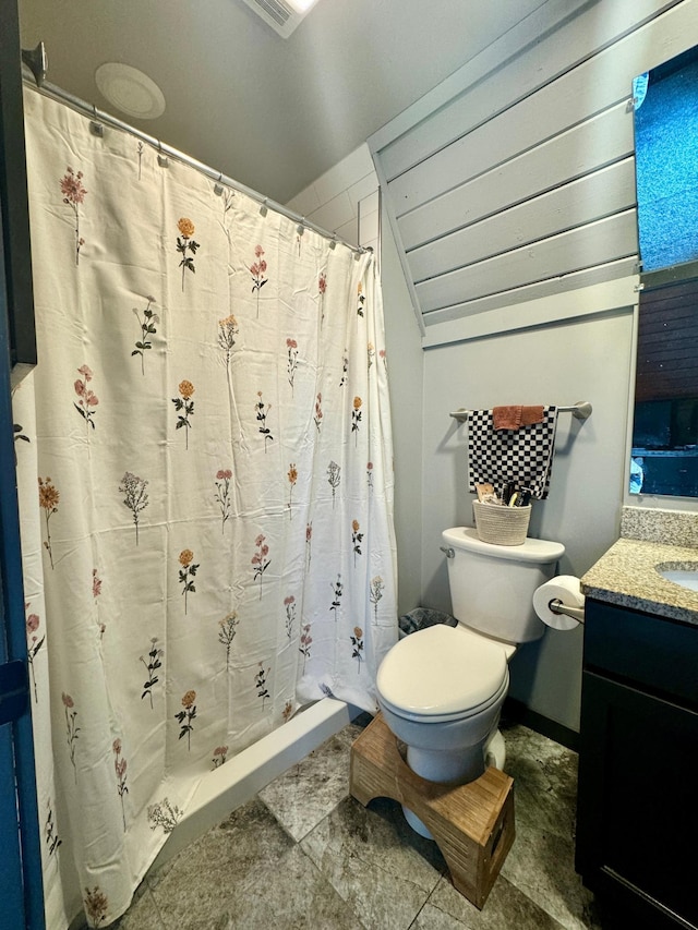 63521 County Road 2, Warroad, MN 56763 - bathroom with vanity, a shower with shower curtain, lofted ceiling, and toilet