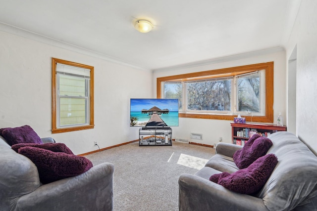 living area with carpet flooring, ornamental molding, and baseboards
