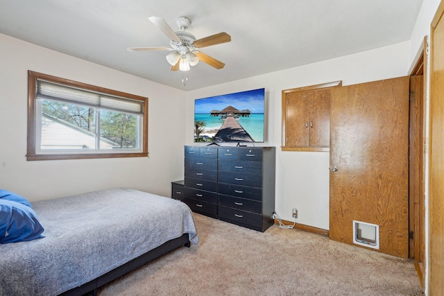 carpeted bedroom featuring a ceiling fan