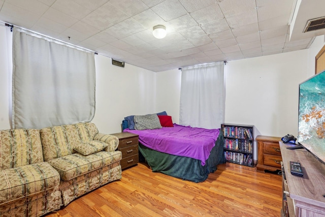 bedroom with wood finished floors