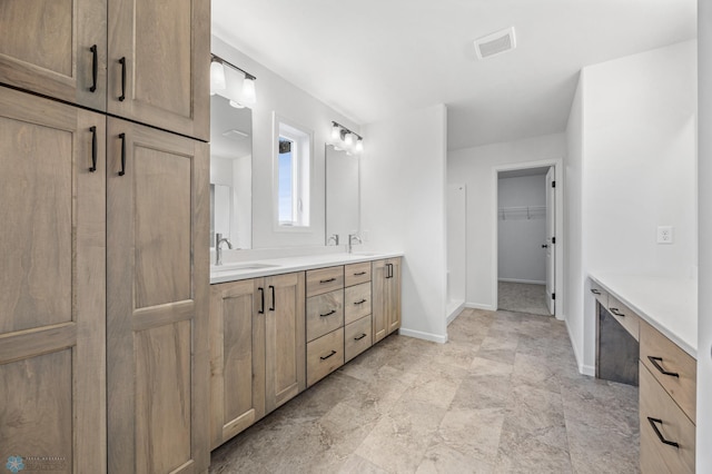 5875 11th St W, West Fargo, ND 58078 - full bathroom with double vanity, baseboards, visible vents, and a sink