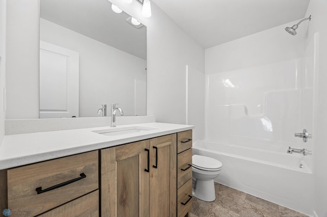 5875 11th St W, West Fargo, ND 58078 - bathroom featuring vanity, washtub / shower combination, stone finish floor, and toilet