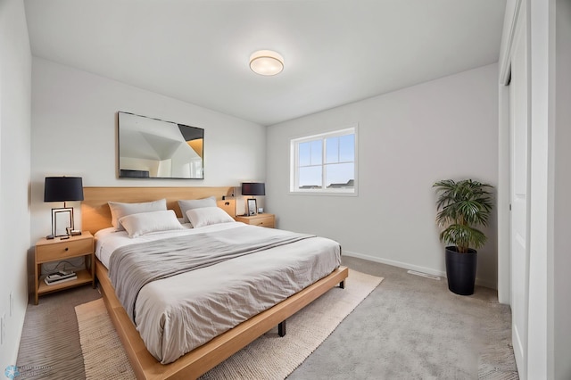 5875 11th St W, West Fargo, ND 58078 - bedroom with baseboards, carpet flooring, and visible vents