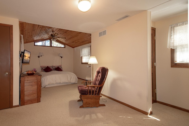 carpeted bedroom featuring baseboards and wood ceiling