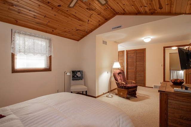 carpeted bedroom with lofted ceiling, wooden ceiling, baseboards, and a closet
