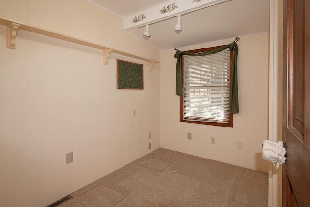 carpeted spare room featuring ornamental molding