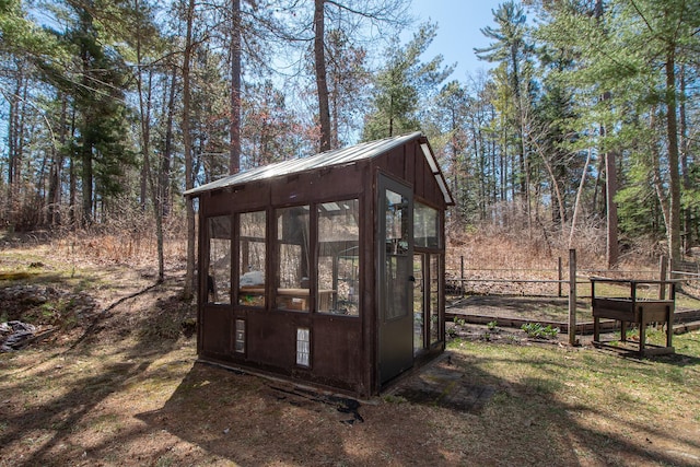 view of greenhouse with fence