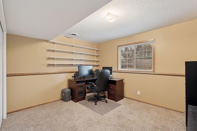 office with baseboards, a textured ceiling, and carpet