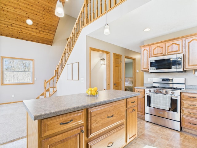 kitchen with light brown cabinetry, a center island, hanging light fixtures, lofted ceiling, and stainless steel appliances