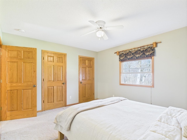 bedroom with carpet flooring and a ceiling fan