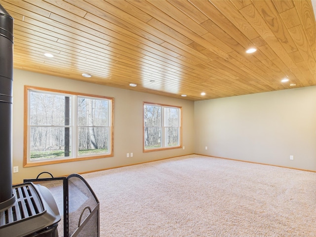 interior space with recessed lighting, carpet, and wood ceiling