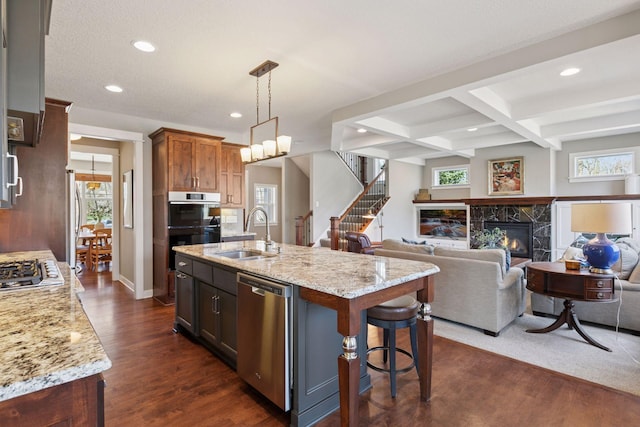 kitchen featuring a sink, appliances with stainless steel finishes, recessed lighting, and a healthy amount of sunlight