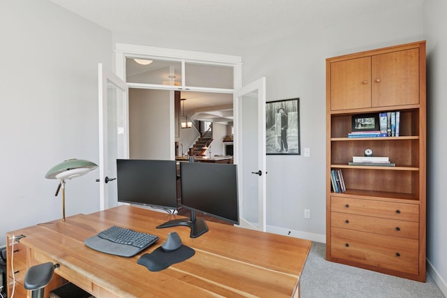 office featuring baseboards, carpet, and french doors