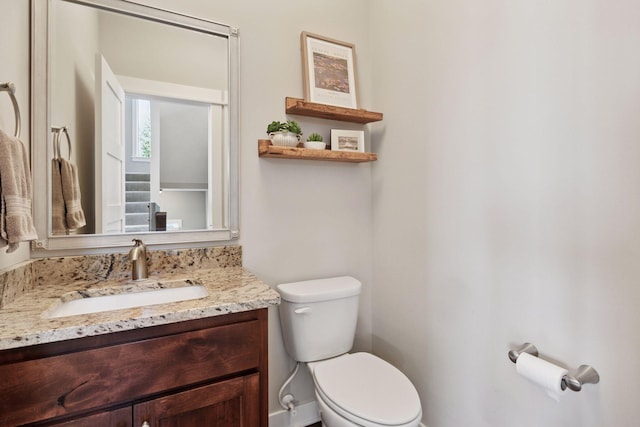 half bath with vanity and toilet