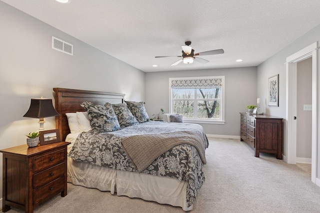 carpeted bedroom with baseboards, a ceiling fan, recessed lighting, and visible vents