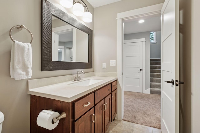 bathroom featuring vanity and baseboards