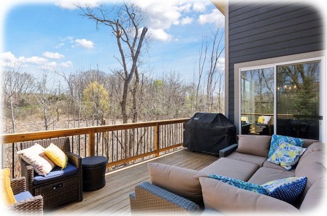 deck featuring a grill and outdoor lounge area