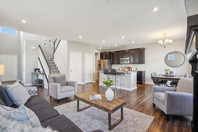 11462 81st Pl N, Maple Grove, MN 55369 - living area with a chandelier, stairway, dark wood-style flooring, recessed lighting, and baseboards