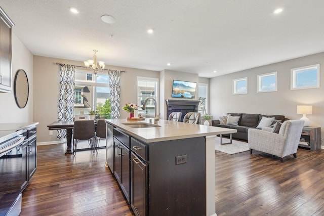 11462 81st Pl N, Maple Grove, MN 55369 - kitchen with a sink, dark wood-style flooring, a chandelier, light countertops, and recessed lighting