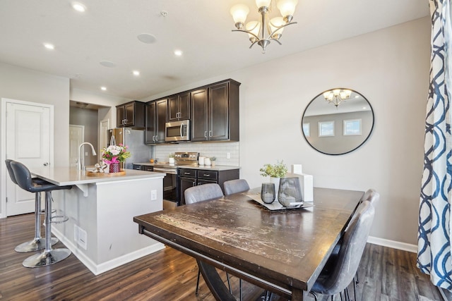 11462 81st Pl N, Maple Grove, MN 55369 - dining room with a chandelier, baseboards, dark wood-type flooring, and recessed lighting