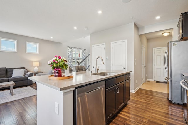 11462 81st Pl N, Maple Grove, MN 55369 - kitchen with stainless steel appliances, a sink, open floor plan, dark wood finished floors, and recessed lighting