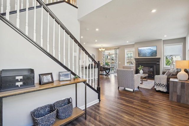 11462 81st Pl N, Maple Grove, MN 55369 - stairs featuring wood finished floors, recessed lighting, a chandelier, and a glass covered fireplace