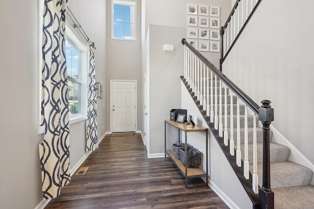 11462 81st Pl N, Maple Grove, MN 55369 - entryway with plenty of natural light, a towering ceiling, dark wood-style floors, baseboards, and stairway