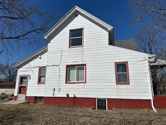 627 7th Ave S, Saint Cloud, MN 56301 - view of home's exterior featuring roof with shingles