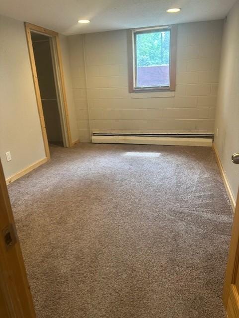 627 7th Ave S, Saint Cloud, MN 56301 - unfurnished room with a baseboard radiator, carpet, baseboards, and concrete block wall