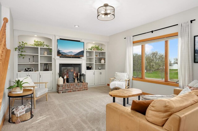 carpeted living area featuring a fireplace