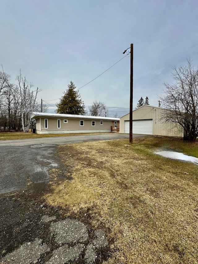 1404 Central Rd, Littlefork, MN 56653 - view of front of home featuring a detached garage and an outdoor structure