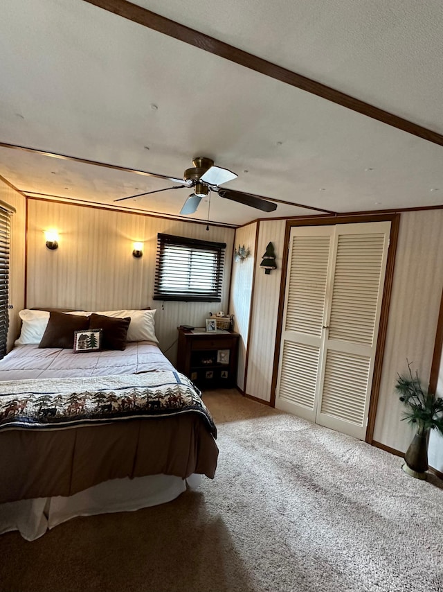1404 Central Rd, Littlefork, MN 56653 - carpeted bedroom with ceiling fan and wooden walls