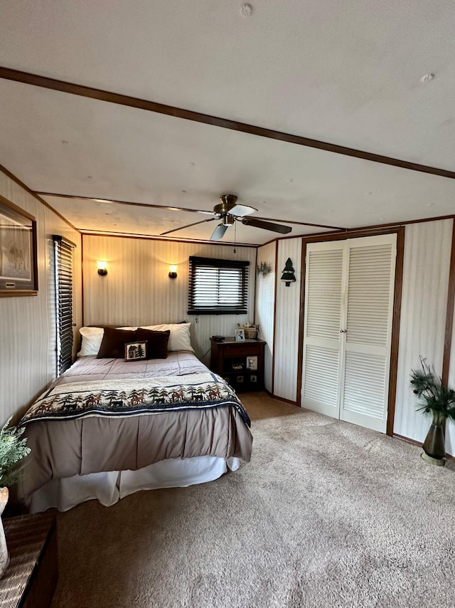 1404 Central Rd, Littlefork, MN 56653 - bedroom featuring carpet flooring, wooden walls, and a ceiling fan