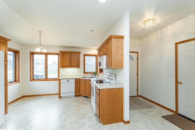274 Dawn Ave, Saint Charles, MN 55972 - kitchen featuring white appliances, baseboards, a wealth of natural light, and light countertops