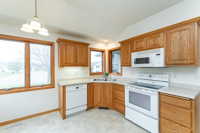 274 Dawn Ave, Saint Charles, MN 55972 - kitchen featuring visible vents, lofted ceiling, white appliances, light countertops, and a sink