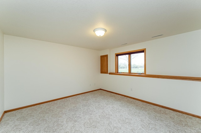 274 Dawn Ave, Saint Charles, MN 55972 - unfurnished room featuring baseboards and light carpet