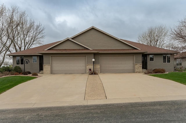 274 Dawn Ave, Saint Charles, MN 55972 - view of front of home with a garage, a front lawn, roof with shingles, brick siding, and driveway