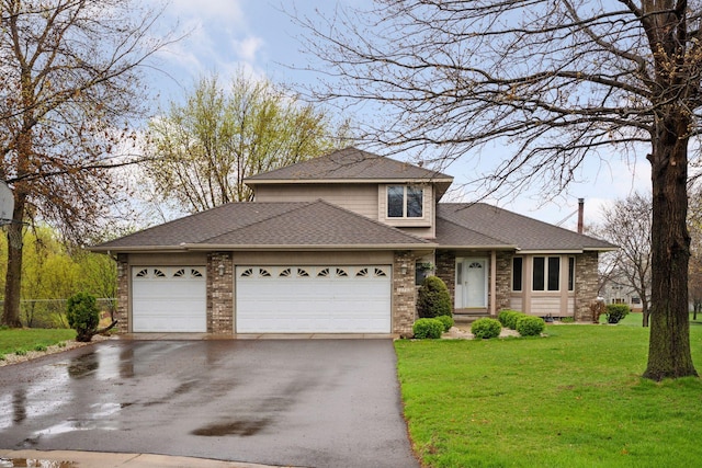 traditional-style house with driveway, a garage, brick siding, a front lawn, and a shingled roof
