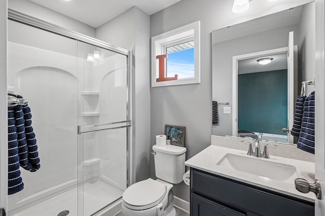 11270 Meadow View Ln, Maple Grove, MN 55311 - bathroom with vanity, toilet, baseboards, and a stall shower