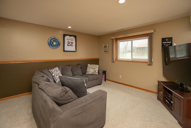 carpeted living area featuring recessed lighting and baseboards