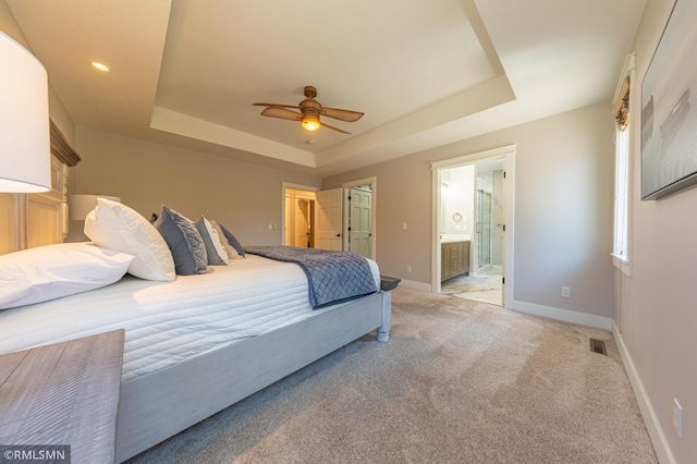 509 Superior Ave, Crosby, MN 56441 - bedroom featuring visible vents, baseboards, a tray ceiling, and light carpet