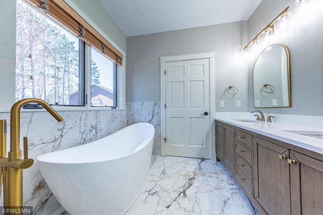 509 Superior Ave, Crosby, MN 56441 - full bath with wainscoting, a sink, double vanity, marble finish floor, and tile walls