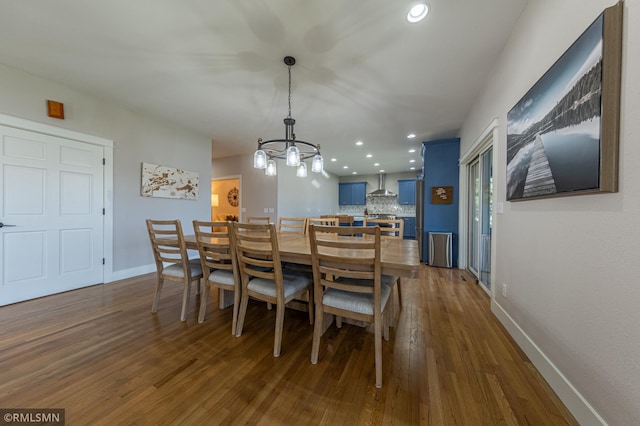 509 Superior Ave, Crosby, MN 56441 - dining space featuring recessed lighting, baseboards, dark wood finished floors, and a chandelier