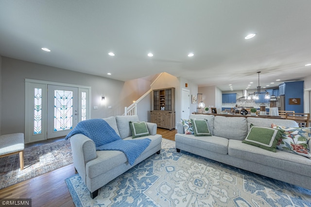 509 Superior Ave, Crosby, MN 56441 - living area with recessed lighting, wood finished floors, a chandelier, and stairway