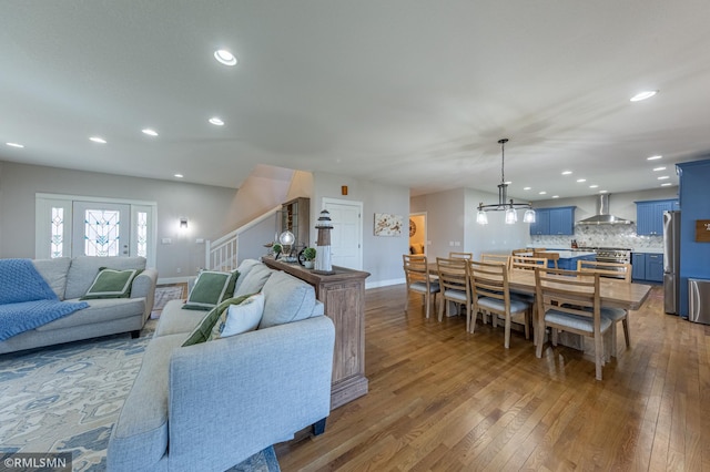 509 Superior Ave, Crosby, MN 56441 - living area featuring an inviting chandelier, stairs, recessed lighting, baseboards, and hardwood / wood-style flooring
