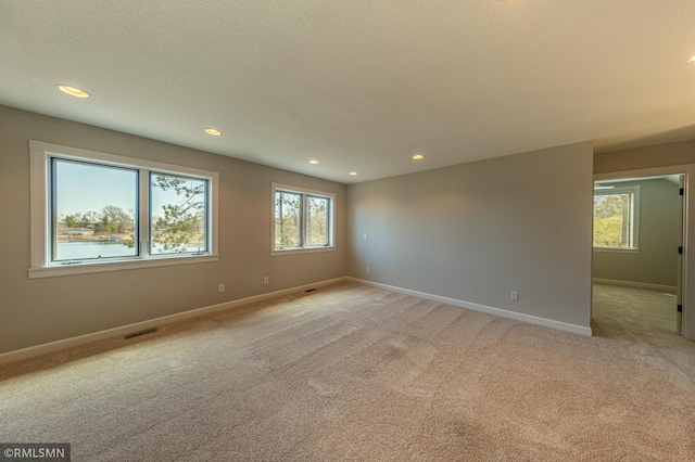 509 Superior Ave, Crosby, MN 56441 - spare room featuring recessed lighting, baseboards, visible vents, and light carpet