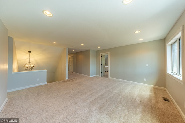 509 Superior Ave, Crosby, MN 56441 - carpeted spare room featuring recessed lighting, baseboards, visible vents, and an inviting chandelier